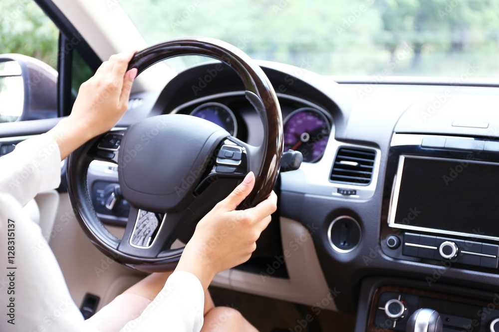Young woman driving car