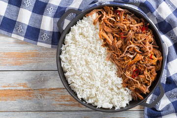 Poster - pulled  pork with long-grain basmati rice in iron stewpot