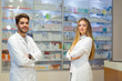 © Mediteraneo - Pharmacists using digital tablet while checking medicine in pharmacy