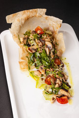 Wall Mural - mushroom salad with tomatoes and Arugula