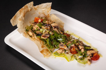 Wall Mural - mushroom salad with tomatoes and Arugula