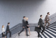 © ImageFlow - Side view of entrepreneurs climbing a stair in a building
