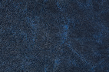 Texture of dark blue vintage leather on macro.