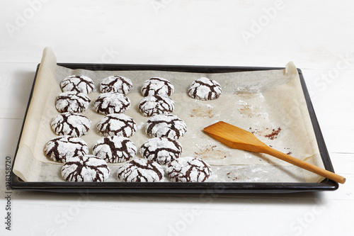 Fotografia, Obraz Homemade chocolate crinkle cookies on a baking sheet