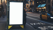Blank Advertising Light Box On Bus Stop, Mockup Of Empty Ad Billboard On Night Station, Template Banner On Background City Street For Text In Barcelona, Afisha Board And Headlights Of Taxi Cars