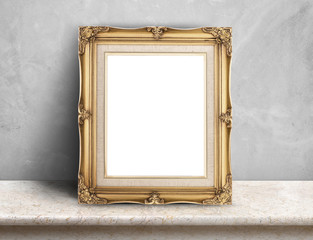 Fototapete - Blank Gold victorian picture frame on cream marble table at grey