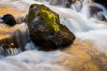 A Long Exposure Of West Maroon Creek Cascading Around Moss-cover