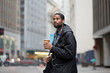 Young African American professional walking to work in the city