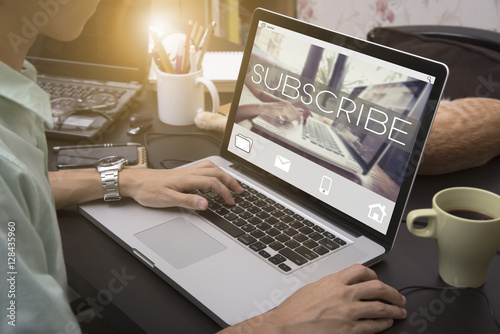 Cuadros en Lienzo business hand typing on a laptop keyboard with Subscribe homepage on the computer screen follow subscription membership social media concept