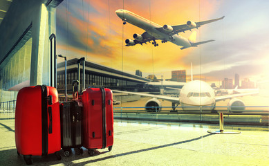 Canvas Print - traveling luggage in airport terminal building and jet plane fly