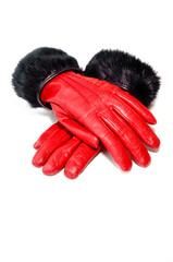 Women’s red winter leather gloves with natural black rabbit fur isolated on white background.