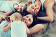 © JackF - Top view on  parents with kids relaxing on beach