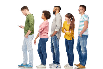 group of people in queue with smartphone