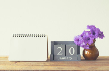 vintage wood calendar for january day 20 on wood table with empt