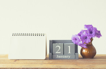 vintage wood calendar for january day 21 on wood table with empt