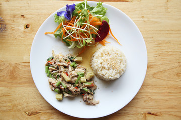 Stir fried chicken and basil served with rice