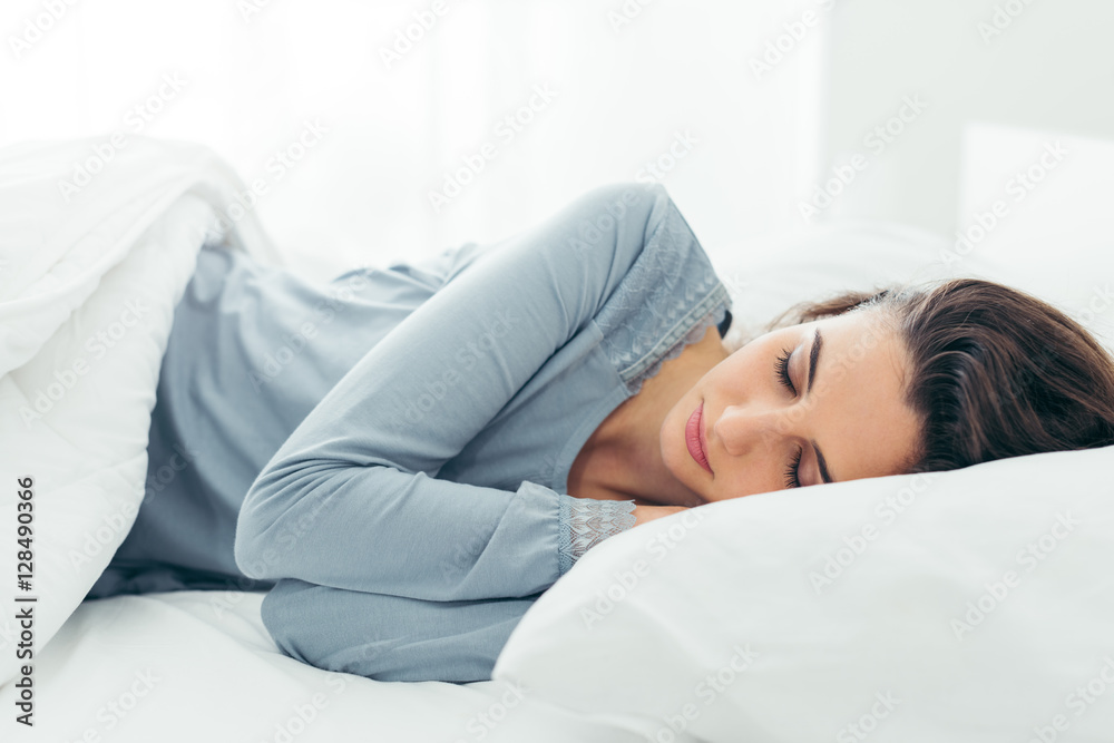 Girl sleeping in her bed - obrazy, fototapety, plakaty 