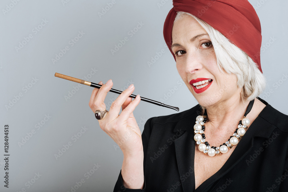 Beautiful senior woman smoking cigarette. Stock Photo | Adobe Stock