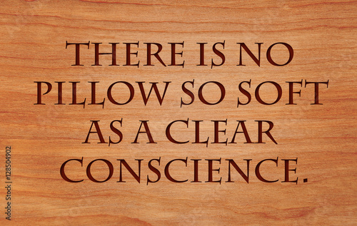 Plakat There is no pillow so soft as a clear conscience - French Proverb on wooden red oak background