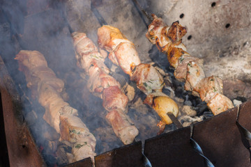 Wall Mural - Grilling marinated pork shashlik preparing on a barbecue grill over charcoal. 