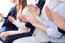 Close Up Of Business People Hands  Clapping At Conference
