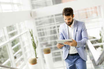 Wall Mural - Young businessman with tablet