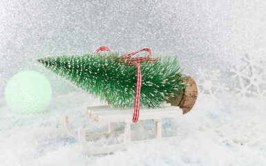 Wall Mural - Small sleigh carrying a Christmas tree