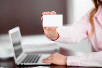 Business woman giving visit card