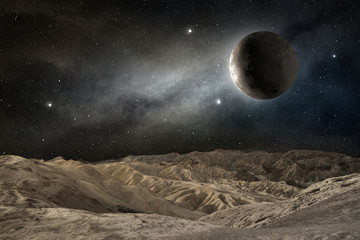 moon on a desert landscape in a starry night