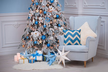Christmas Home Interior - A Cozy Armchair And Decorated Fir In Blue White Colors