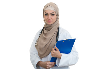 Wall Mural - Closeup portrait of friendly, smiling confident muslim female doctor holding folder.