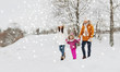© Syda Productions - happy family in winter clothes walking outdoors