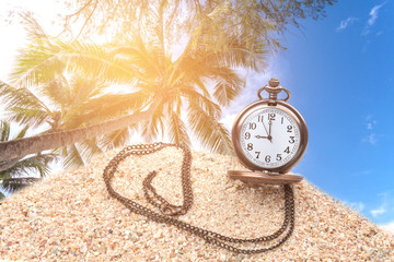 old pocket watch on the sand