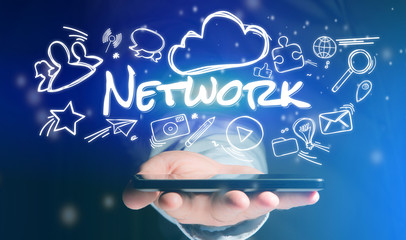 Concept of man holding smartphone with network icon around