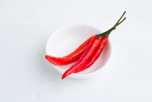Red Chili Peppers In A White Plate