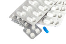 Pills In Blister Packs On White Background.