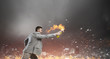 © Sergey Nivens - Businessman throwing petrol bomb . Mixed media