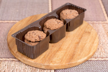 Brown biscuits cookies with chocolate in plastic packaging