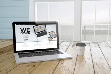 Poster - laptop with we design websiteon screen with port background and