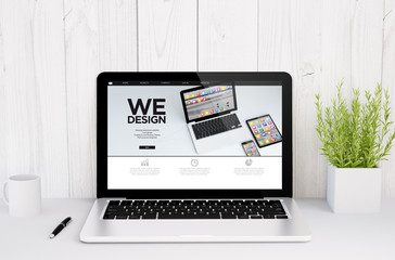 Poster - laptop on table we design