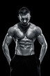 © nazarovsergey - Muscular bodybuilder guy doing posing