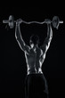 © nazarovsergey - bodybuilder lifting a barbell on black background