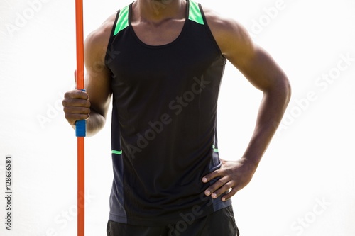 Fotografie, Tablou Happy athlete standing with javelin