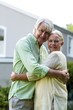 © WavebreakmediaMicro - Smiling senior couple embracing