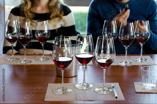 Cuadros en Lienzo Wine tasting experience in Langhe (Italy) with three glasses of Nebbiolo on a ta
