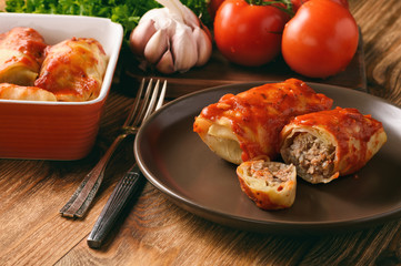 Wall Mural - Stuffed cabbage leaves with minced meat and rice in tomato sauce.