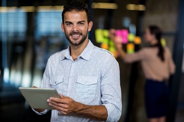 Aufkleber - Young man using digital tablet