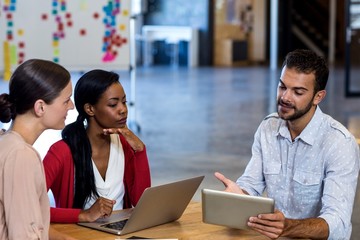 Aufkleber - Team of colleagues discussing at their desk