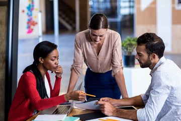 Aufkleber - Team of colleagues discussing at their desk