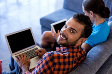 Aufkleber - Colleagues siting on sofa using laptop